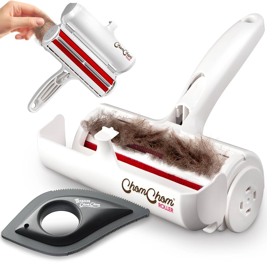 ChomChom Roller reusable pet hair remover with collected pet hair in its chamber and a detailer tool