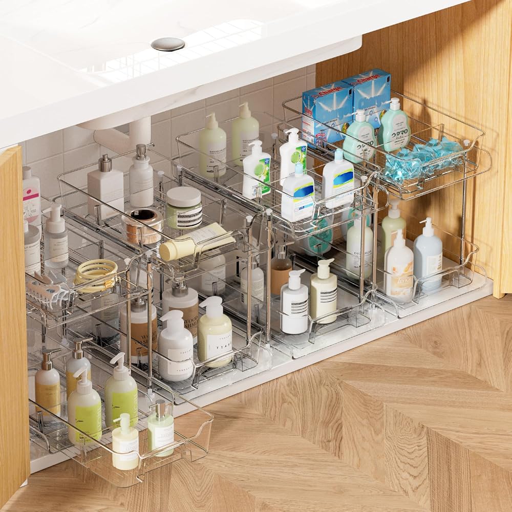 Vtopmart clear 2-tier pull-out under sink organizers filled with bottles under a bathroom sink
